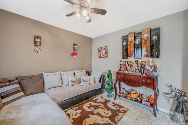 living room featuring ceiling fan and light tile patterned flooring