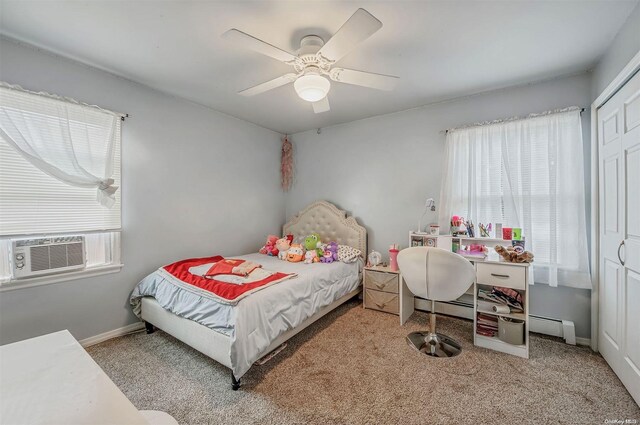 bedroom with light colored carpet, a baseboard radiator, multiple windows, and ceiling fan