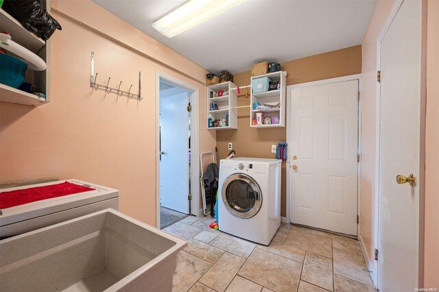 washroom featuring sink and washer / clothes dryer