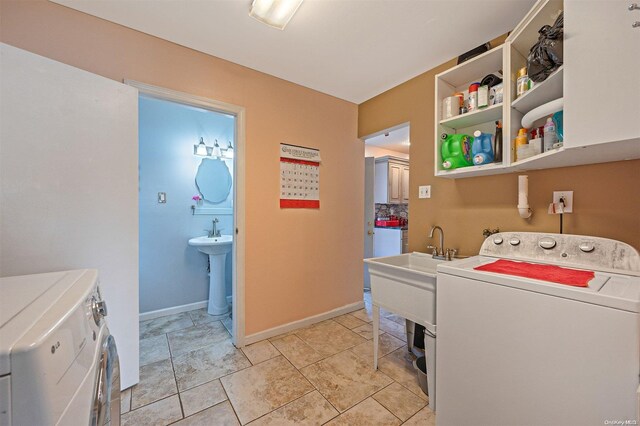 washroom featuring independent washer and dryer and sink