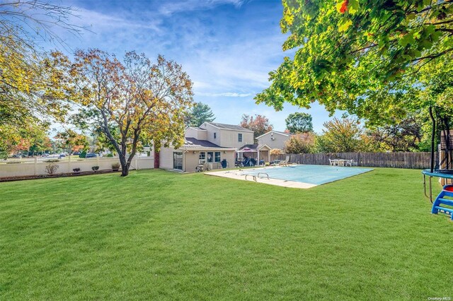 view of yard with a patio area and a trampoline