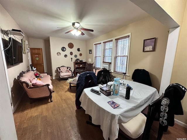 dining space with ceiling fan and light hardwood / wood-style floors