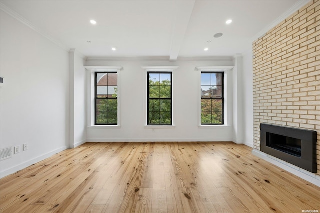 583 Putnam Ave Unit 4, Brooklyn, NY 11221 - unfurnished living room featuring hardwood / wood-style floors, a brick fireplace, baseboards, ornamental molding, and recessed lighting