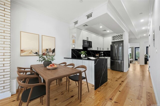 583 Putnam Ave Unit 4, Brooklyn, NY 11221 - dining room with light wood finished floors, ornamental molding, and recessed lighting