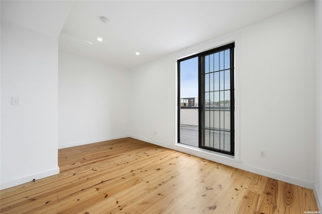 583 Putnam Ave Unit 4, Brooklyn, NY 11221 - unfurnished room featuring hardwood / wood-style floors, baseboards, a smoke detector, and recessed lighting