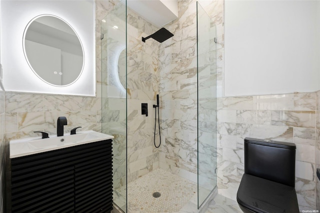 583 Putnam Ave Unit 4, Brooklyn, NY 11221 - bathroom featuring tile walls, a marble finish shower, vanity, and marble finish floors