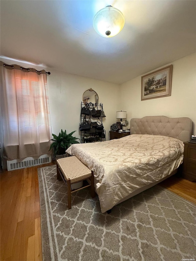 bedroom with hardwood / wood-style floors