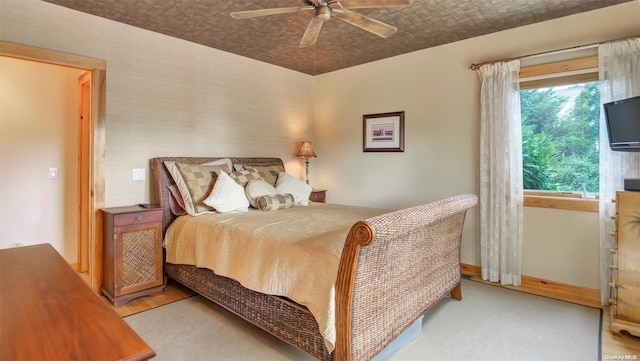 bedroom featuring ceiling fan and light hardwood / wood-style floors