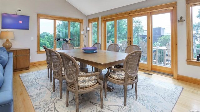 25 Oceanview Dr, Southampton, NY 11968 - dining space with plenty of natural light, french doors, baseboards, lofted ceiling, and light wood-type flooring