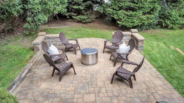 25 Oceanview Dr, Southampton, NY 11968 - view of patio / terrace with an outdoor fire pit