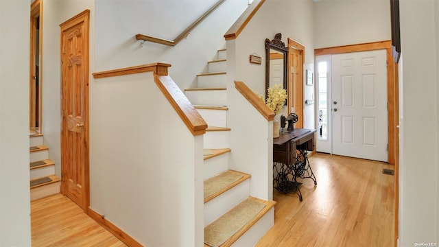 25 Oceanview Dr, Southampton, NY 11968 - foyer with visible vents, stairs, and wood finished floors