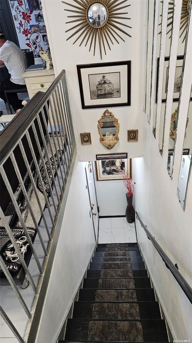 staircase featuring hardwood / wood-style flooring