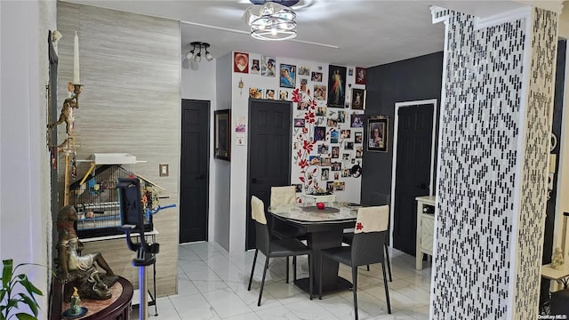 dining space with tile walls