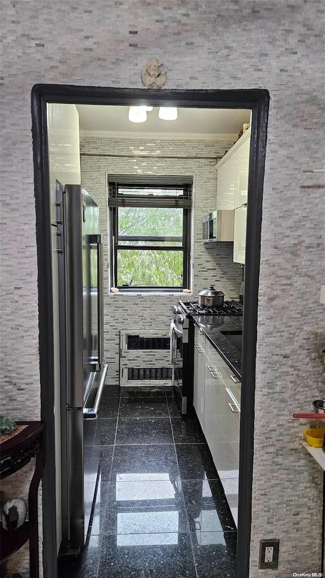 kitchen with stainless steel appliances and white cabinetry