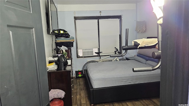 bedroom featuring dark hardwood / wood-style flooring and a closet