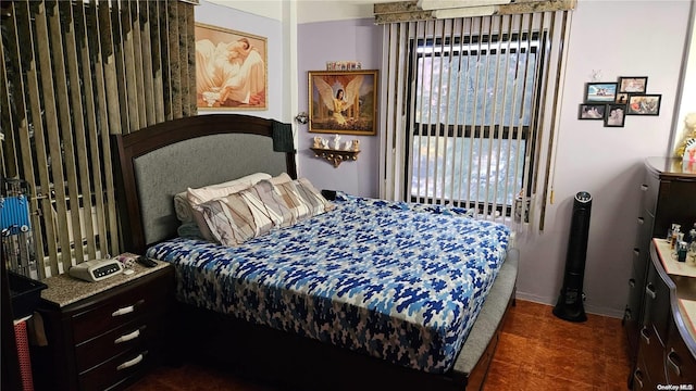 bedroom with dark tile patterned flooring