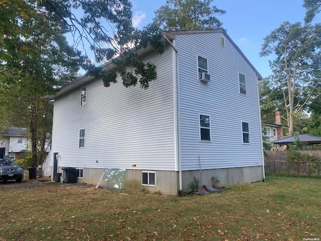 view of side of property with a yard