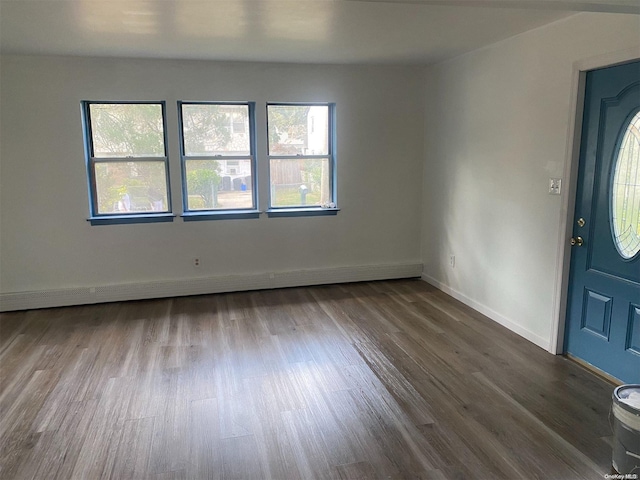 foyer featuring hardwood / wood-style floors and baseboard heating