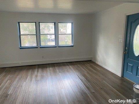 unfurnished room featuring hardwood / wood-style floors