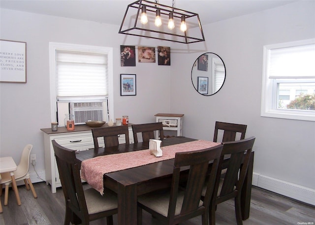 dining space with dark hardwood / wood-style floors, cooling unit, and baseboard heating