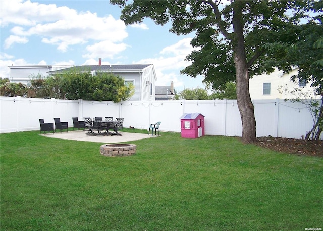 view of yard featuring a patio and an outdoor fire pit