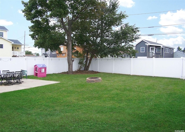 view of yard featuring a patio area and an outdoor fire pit