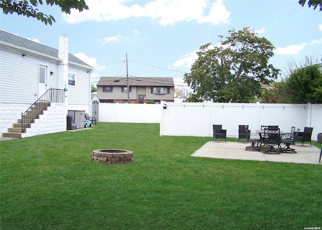 view of yard with a patio area and a fire pit