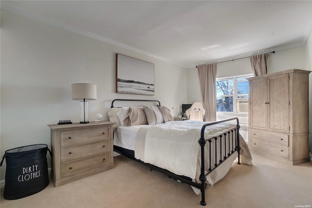 bedroom featuring crown molding and light colored carpet