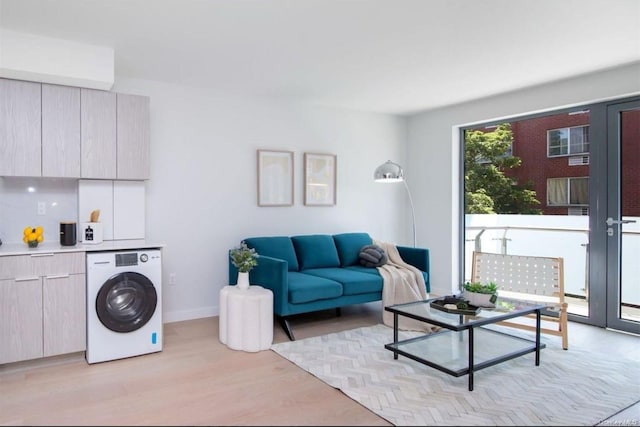 136-80 41st Ave Unit 4A, Flushing, NY 11355 - living area with washer / dryer, light wood-type flooring, french doors, and baseboards