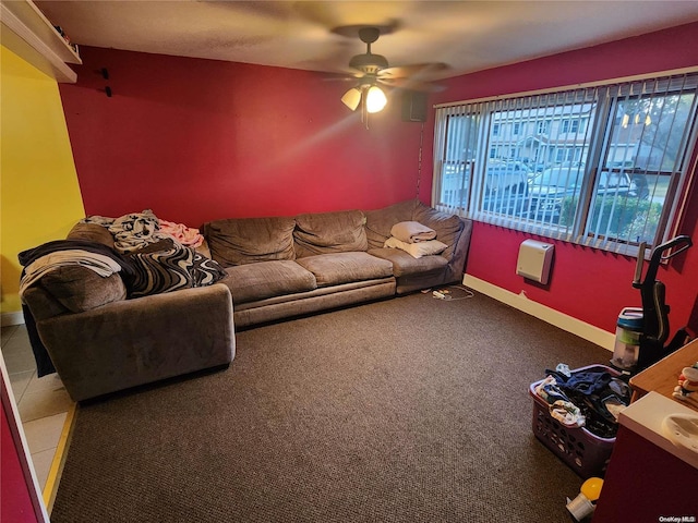 carpeted living room featuring ceiling fan