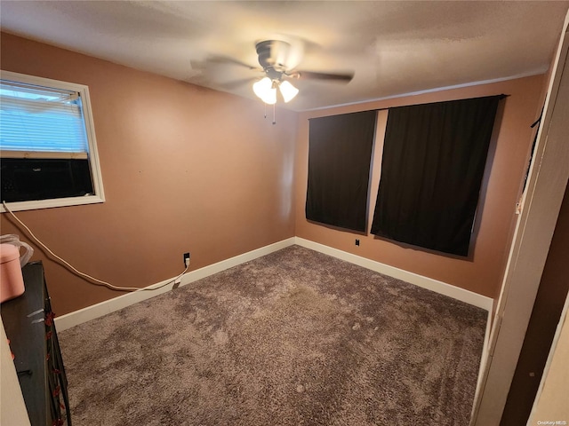 unfurnished room with carpet floors and ceiling fan