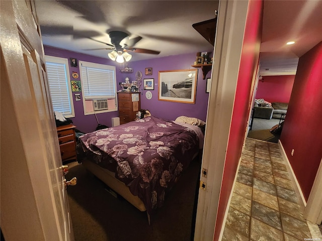 bedroom featuring ceiling fan and cooling unit