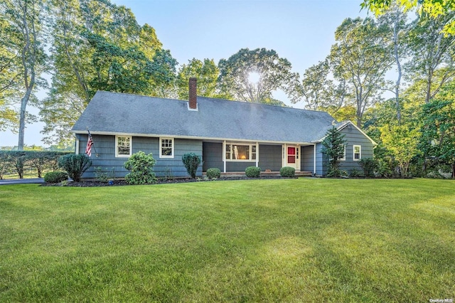 single story home featuring a front yard