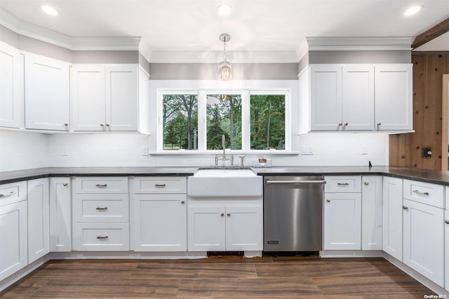 kitchen featuring dishwasher, sink, white cabinetry, and hanging light fixtures