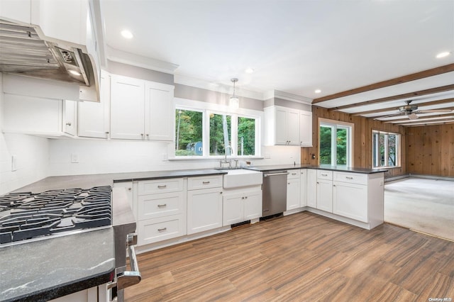 kitchen with beamed ceiling, white cabinets, and stainless steel dishwasher