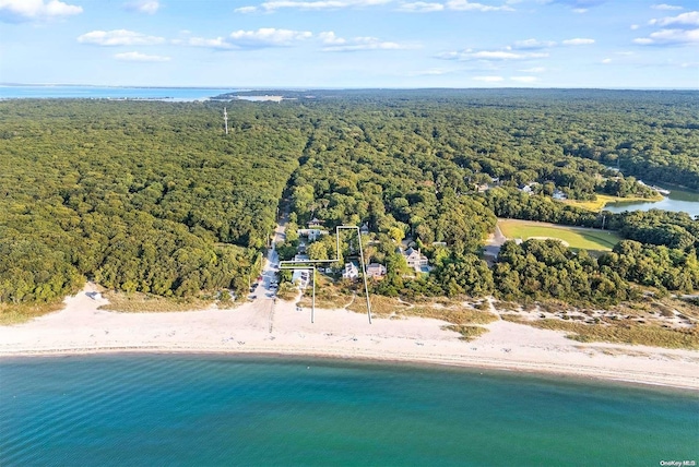 aerial view with a water view and a beach view