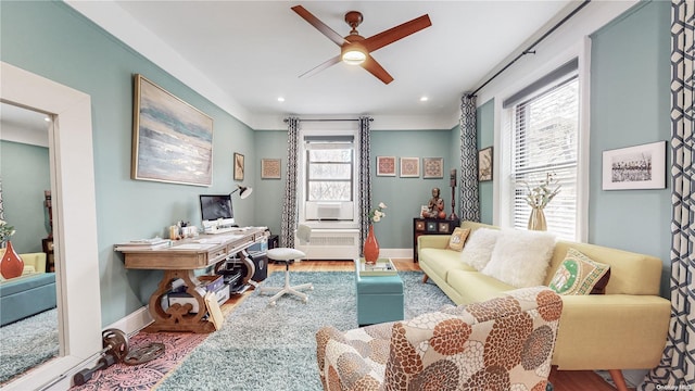 living room featuring a wealth of natural light, ceiling fan, and hardwood / wood-style flooring