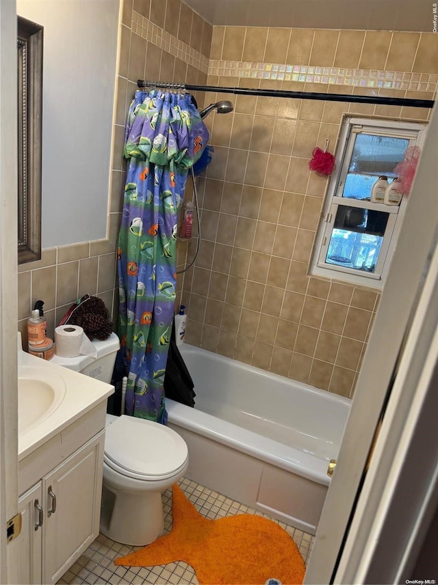 full bathroom featuring vanity, tile patterned flooring, toilet, tile walls, and shower / tub combo with curtain