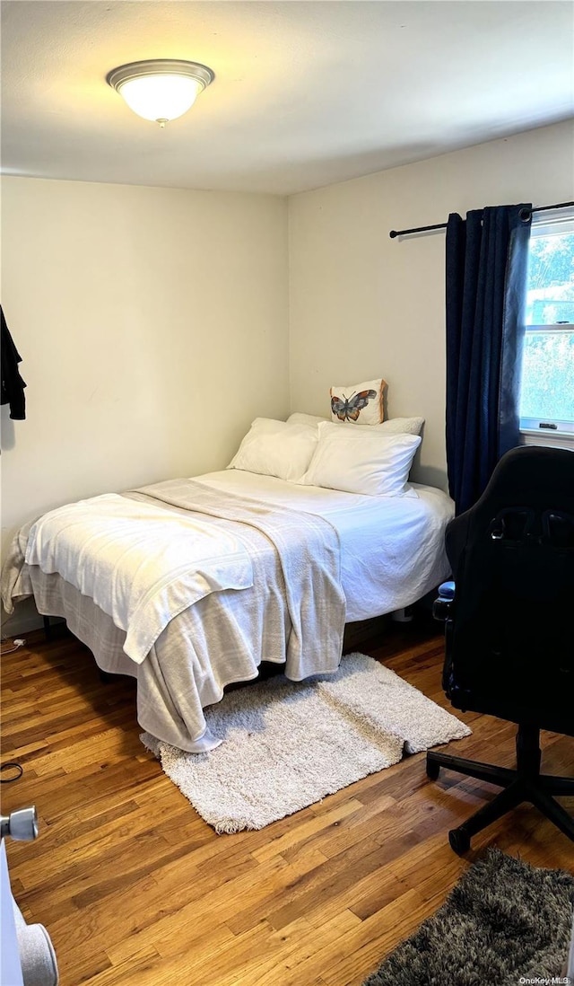 bedroom featuring hardwood / wood-style flooring