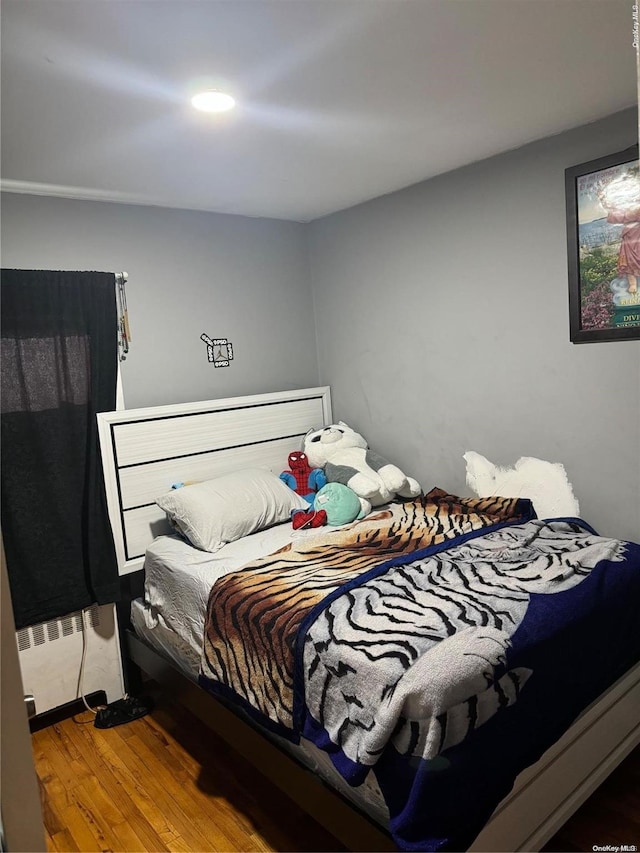 bedroom featuring wood-type flooring