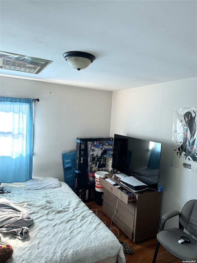 bedroom featuring dark wood-type flooring