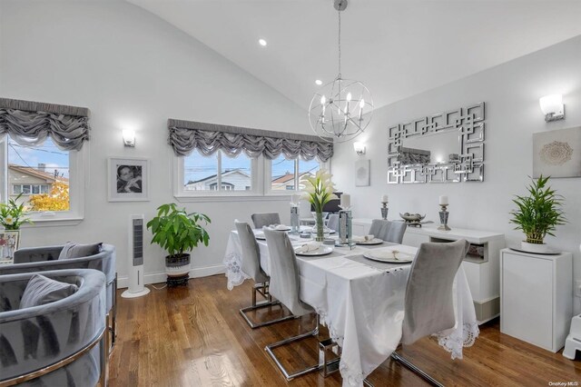 160-28 87th St, Howard Beach, NY 11414 - dining space with a chandelier, plenty of natural light, wood finished floors, recessed lighting, and high vaulted ceiling