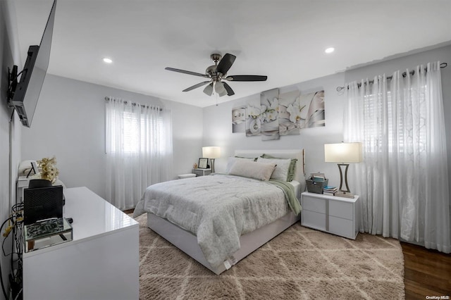 bedroom with wood-type flooring and ceiling fan