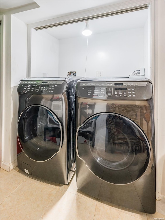 washroom with tile patterned floors and separate washer and dryer