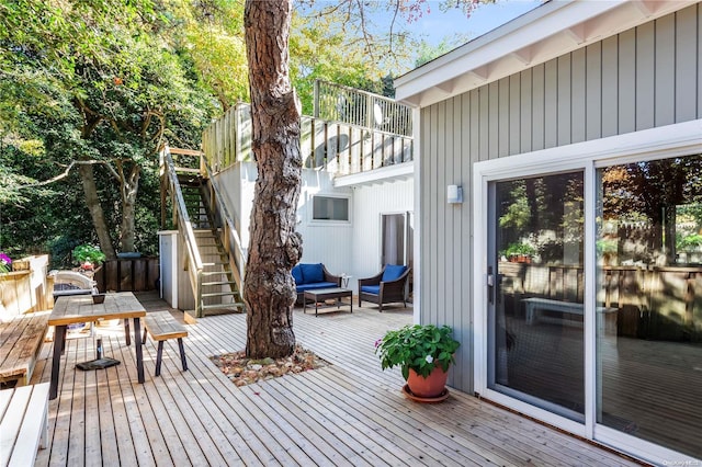 wooden terrace with outdoor lounge area