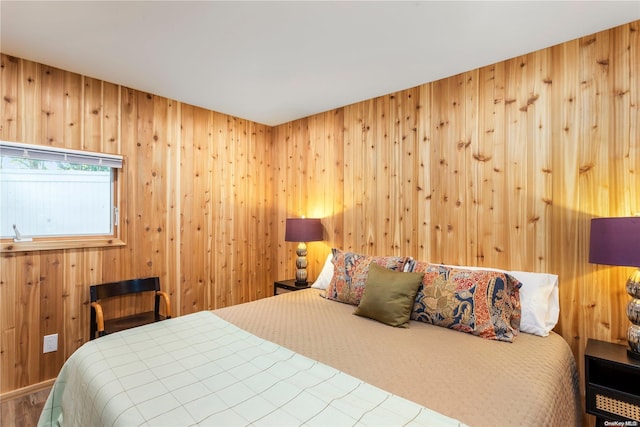 bedroom with wooden walls