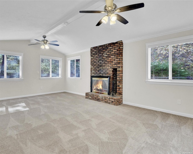 unfurnished living room featuring light carpet, crown molding, vaulted ceiling with beams, ceiling fan, and a fireplace