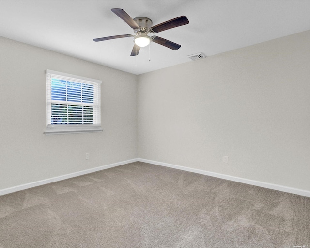 unfurnished room with ceiling fan and carpet floors