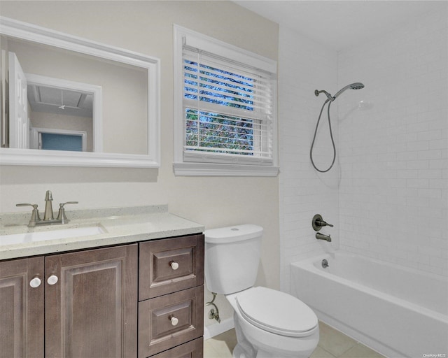 full bathroom featuring tile patterned floors, vanity, tiled shower / bath combo, and toilet