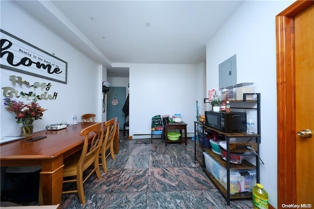 dining area featuring baseboard heating and electric panel